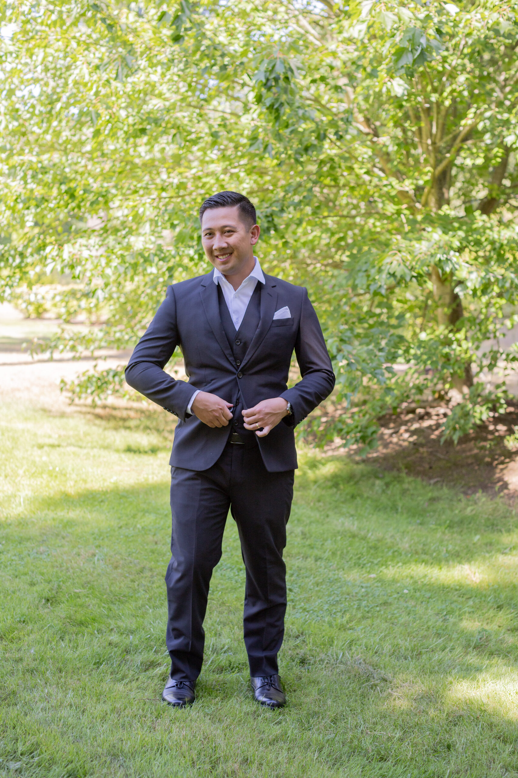 groom-in-black-suit-smiling