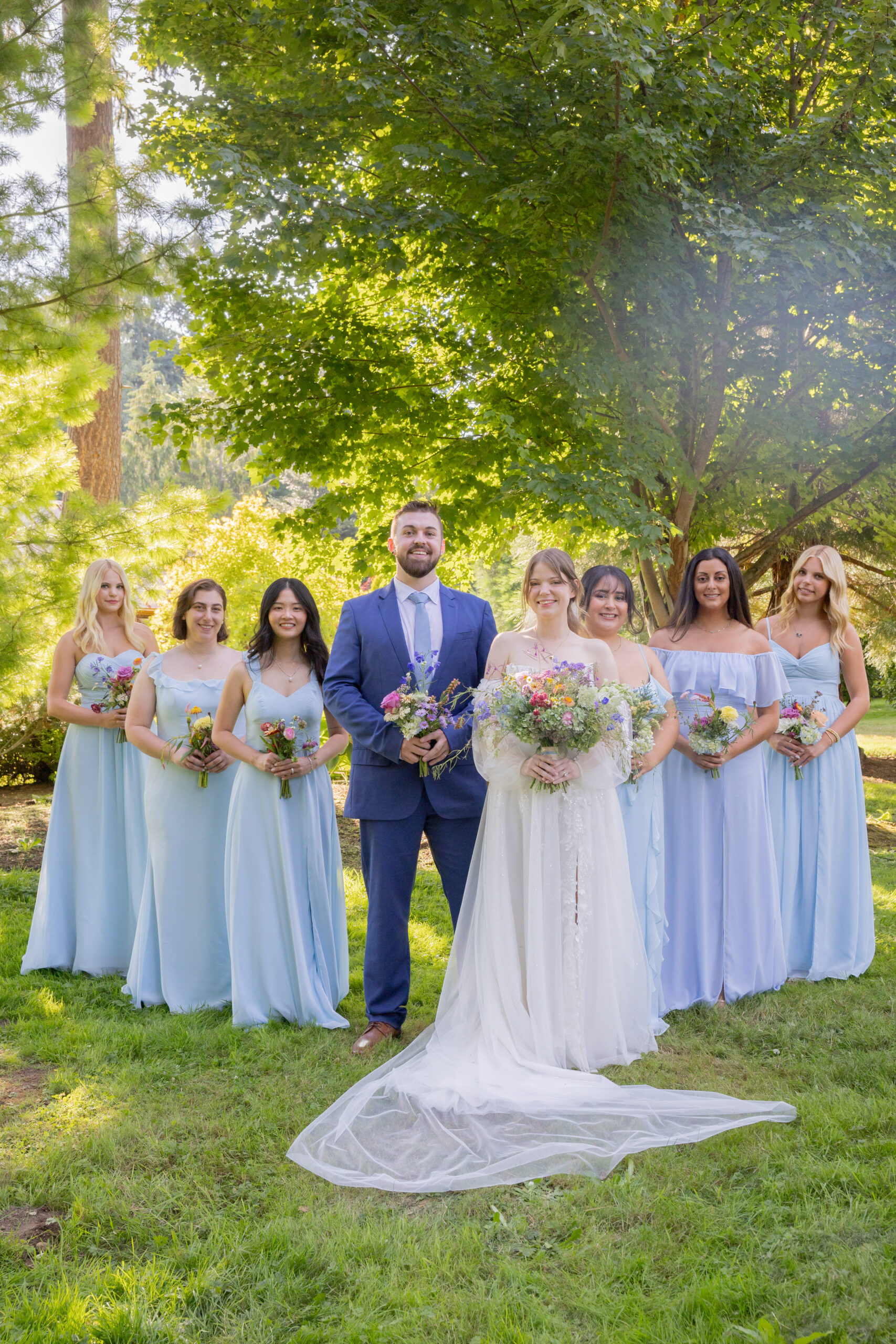 bride-with-bridal-party-holding-wildflower-bouquets