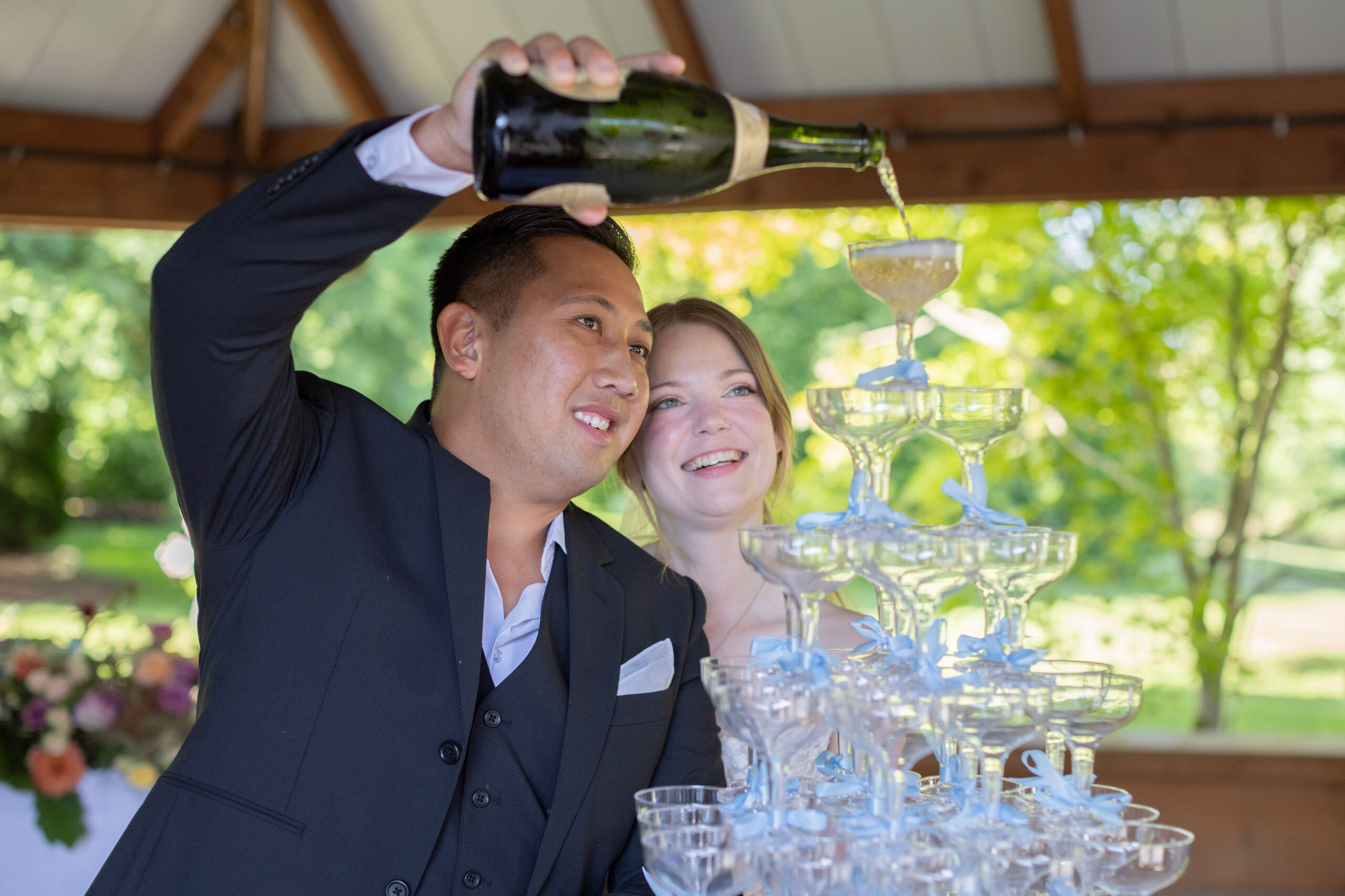 bride-and-groom-pouring-champagne-tower