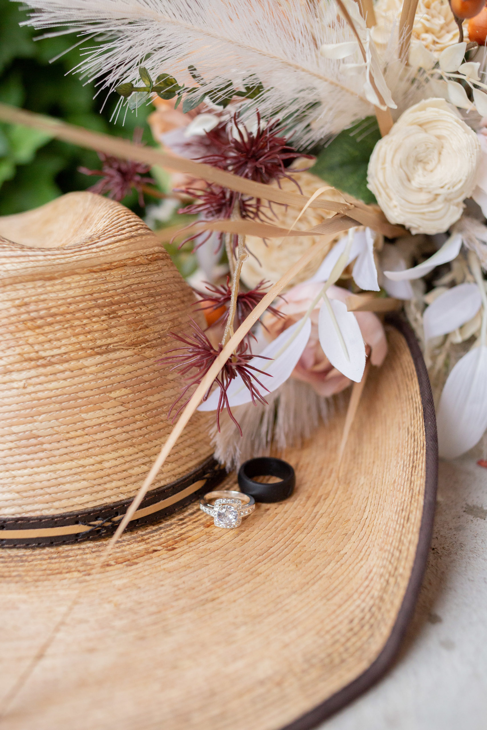 outdoor idaho wedding, rings on cowboy hat