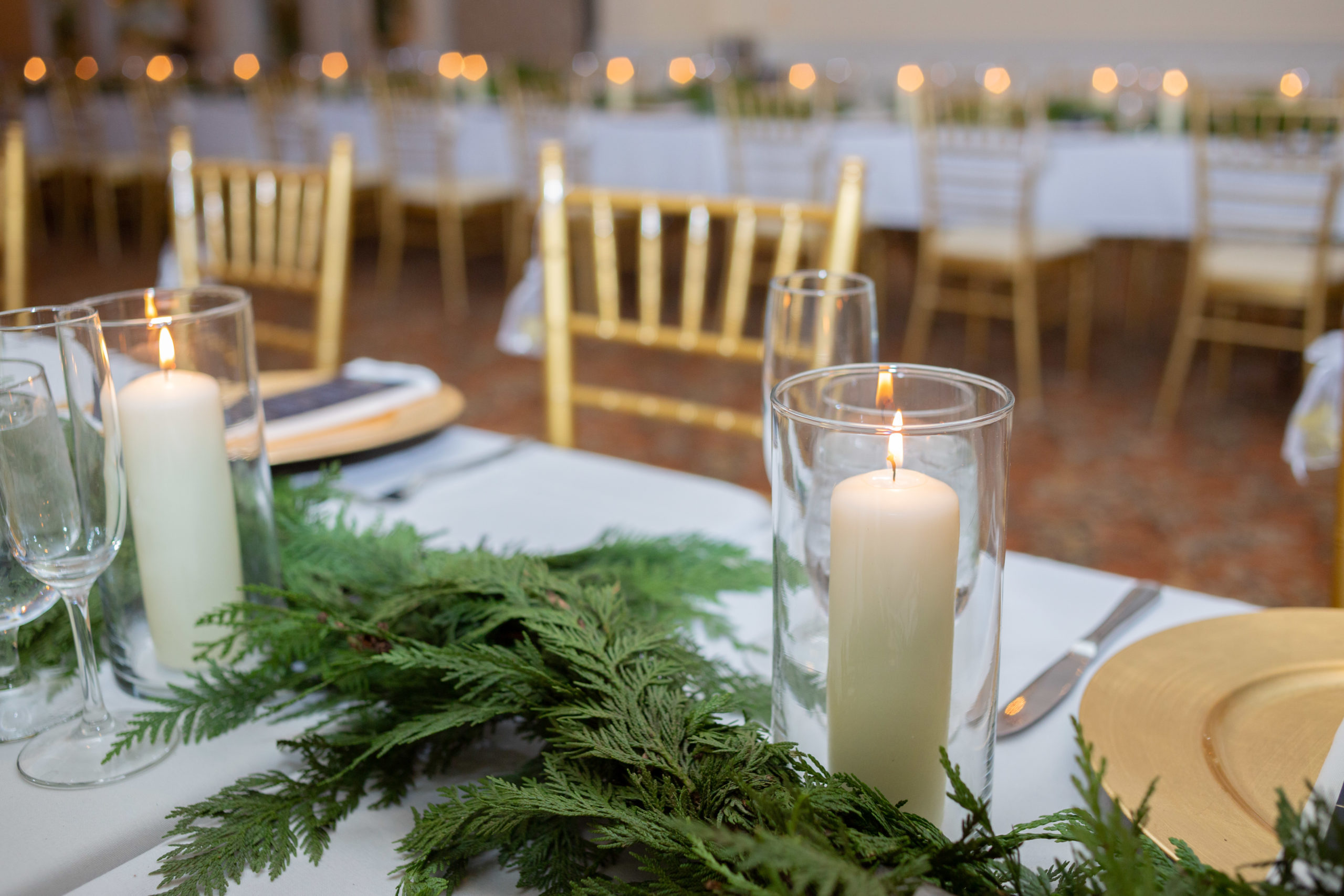 evergreen and candles wedding decor
