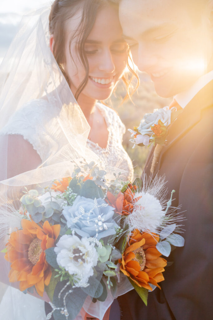 bride-and-groom-looking-at-bouquet
