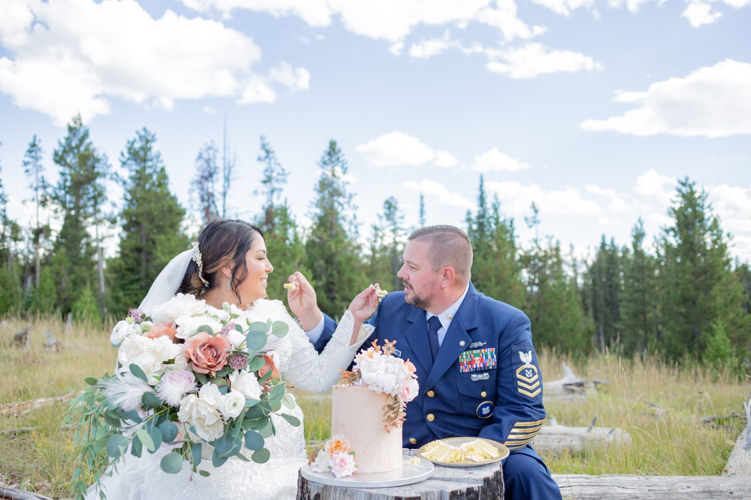 PNW Elopement Photographer captures bride and groom feeding one another cake